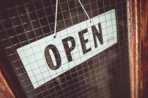 Open sign on the door of a shop — Stock Photo