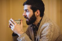 Man having a cup of coffee at home — Stock Photo