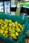 Pears in tray on display shelf in supermarket — Stock Photo