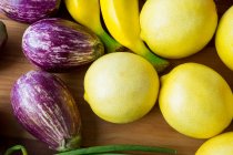 Top view of lemons, eggplants and bananas in supermarket — Stock Photo
