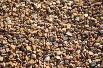 Close-up de textura de pedras de cascalho, quadro completo — Fotografia de Stock