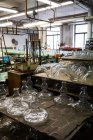 Empty glassware in workshop at glassblowing factory — Stock Photo