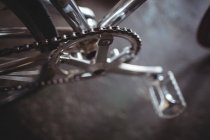 Close up of new silver bicycle in workshop — Stock Photo