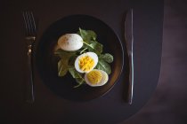 Plate of eggs meal on table — Stock Photo