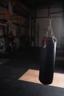 Punching bag for boxing or kick boxing sport in fitness studio — Stock Photo