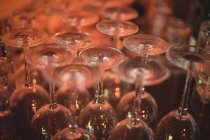 Close-up of wine glasses at bar counter — Stock Photo