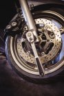 Close-up of motorcycle wheel in industrial mechanical workshop — Stock Photo