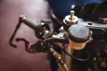 Close-up of motorbike parts in workshop — Stock Photo