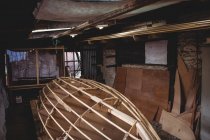 Wooden boat under construction in boatyard — Stock Photo