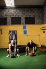 Thai boxers exercising with fitness balls in the fitness studio — Stock Photo