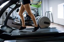 Woman exercising on treadmill at gym — Stock Photo