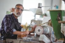 Portrait of glassblower working on a glass at glassblowing factory — Stock Photo