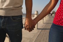 Mid section of couple standing at promenade — Stock Photo
