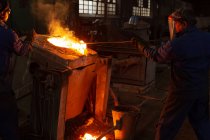 Male workers working in foundry workshop — Stock Photo
