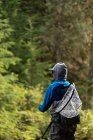 Rear view of fisherman fly fishing in river — Stock Photo