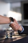 Close-up of business people shaking hand with each other — Stock Photo