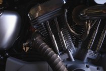 Close-up of motorbike engine at garage — Stock Photo