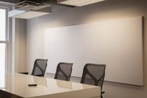 Empty chairs and table at conference room in office — Stock Photo