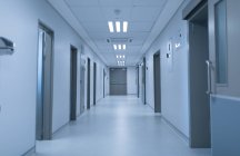Front view of an empty modern corridor of hospital. — Stock Photo