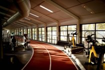 Interior of empty running track in fitness center — Stock Photo