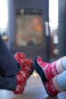 Close up of diverse couple in living room sitting by fireplace. spending time off at home. — Stock Photo