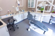 Interior of empty modern dental clinic with dental chair and tools. healthcare and dentistry business. — Stock Photo