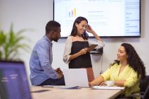 Happy diverse group of business people discussing work in modern office. business and office workplace. — Stock Photo