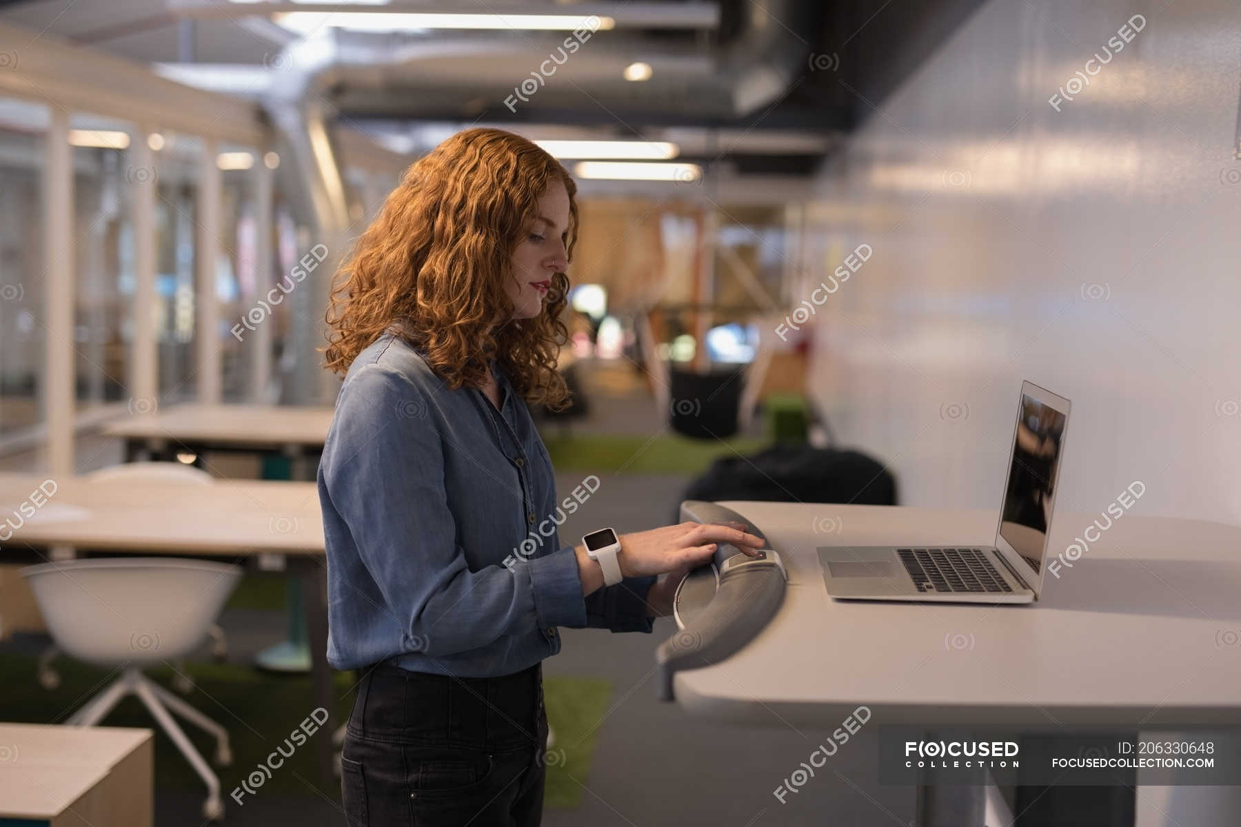 Female Executive Exercising On Treadmill In Office One Person