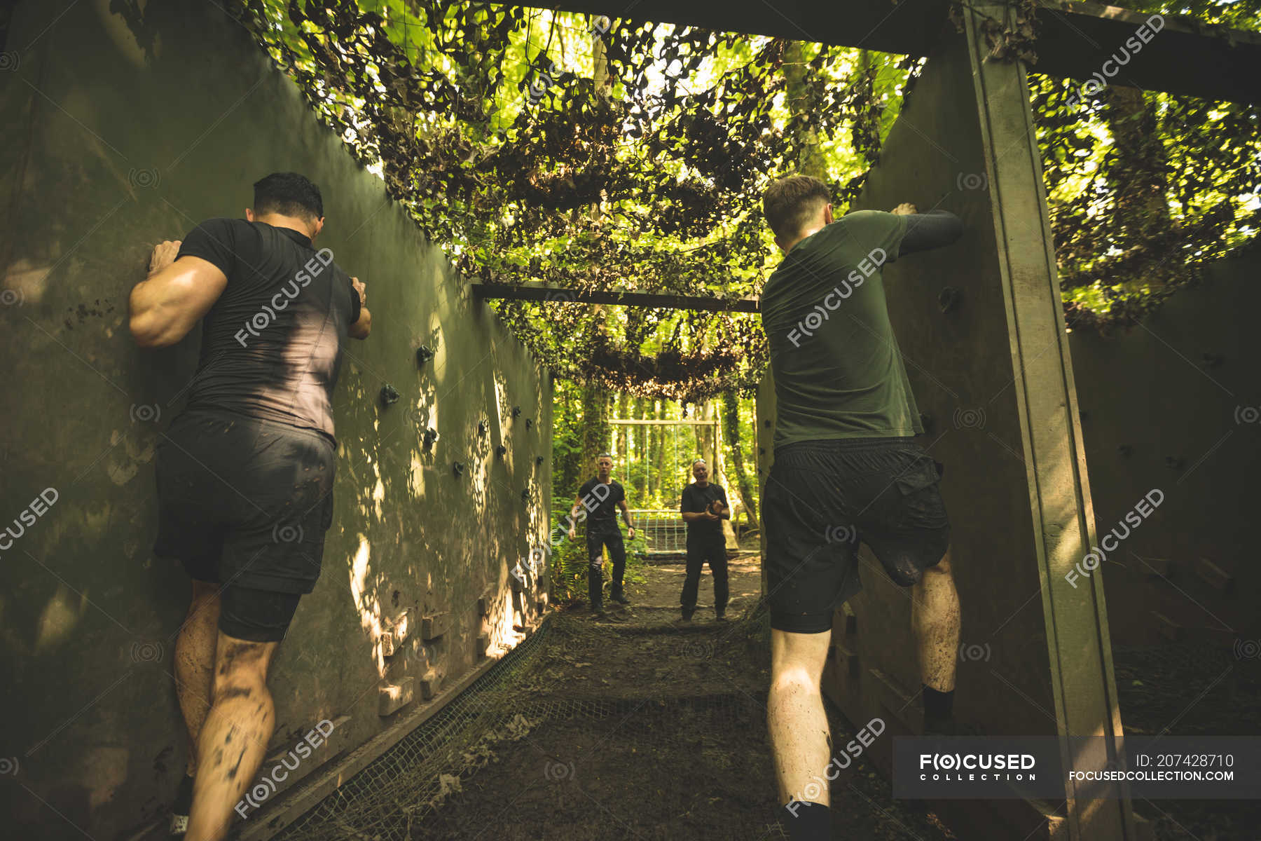 Fit men training over obstacle course at boot camp — 30s, exercise ...