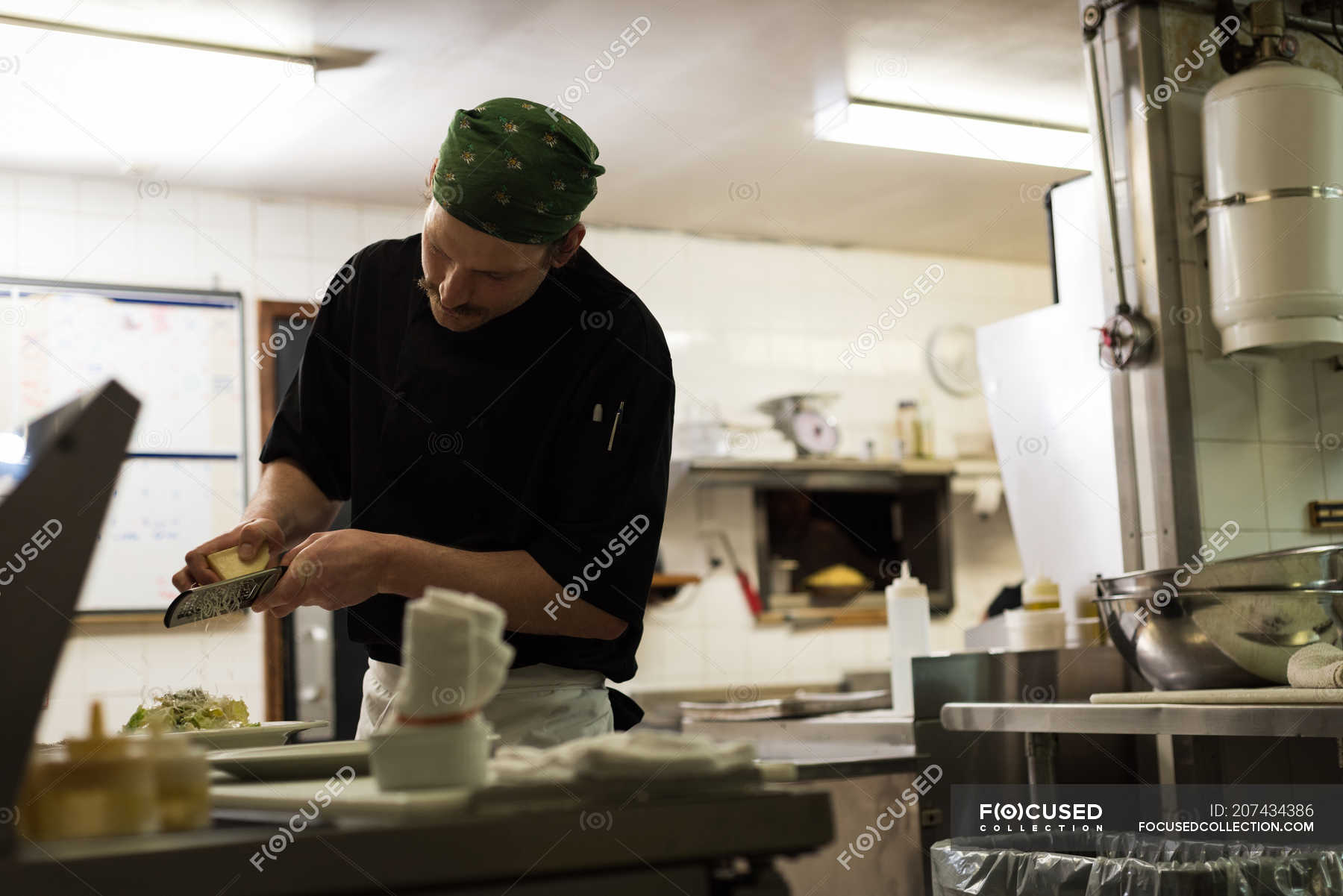 Male chef serving food in a plate at restaurant — hotel, caucasian ...