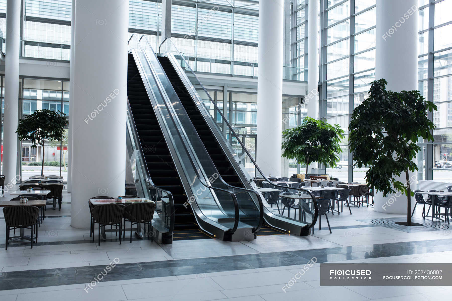 Escalator and cafeteria area inside the office — architecture,  transportation - Stock Photo | #207436802