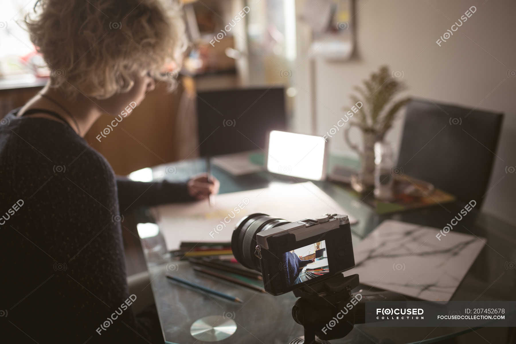 Female blogger drawing a sketch at home — coronavirus, video blog