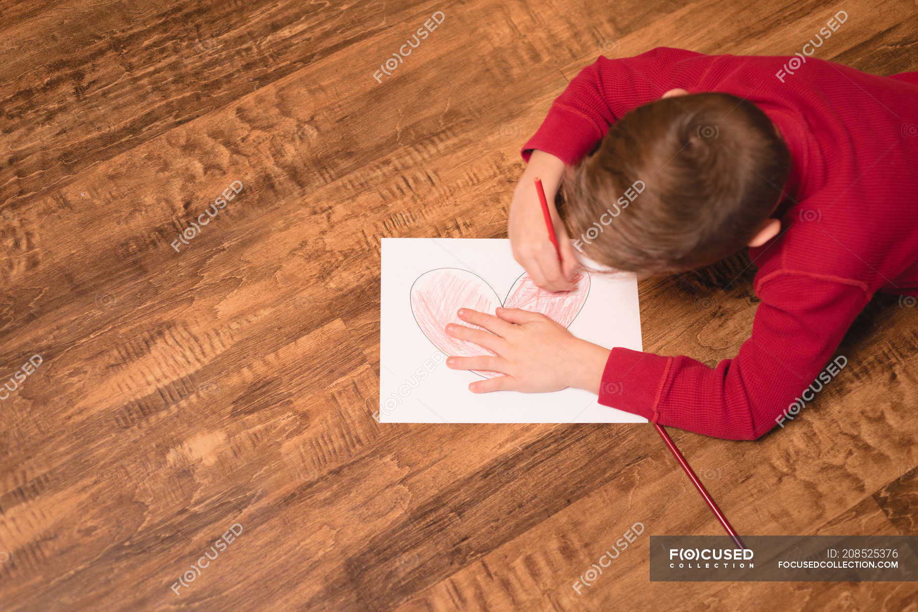 Boy Drawing On Craft Paper At Home Heart Shape One Person