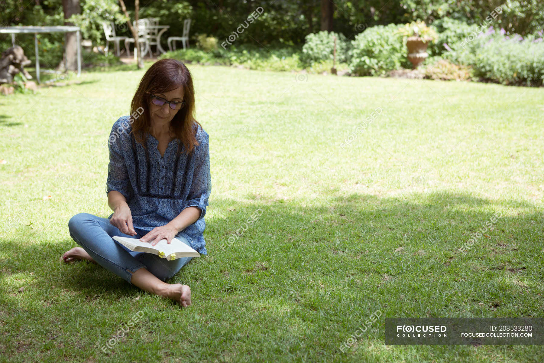 https://st.focusedcollection.com/18590116/i/1800/focused_208533280-stock-photo-woman-reading-book-garden-sunny.jpg