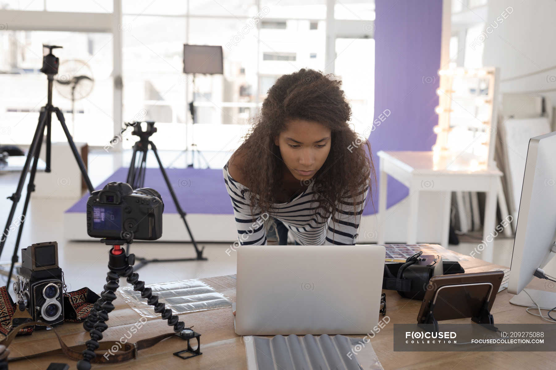 Photographer Using Laptop At Desk In The Photo Studio 18 19 Years Handsome Stock Photo 209275088