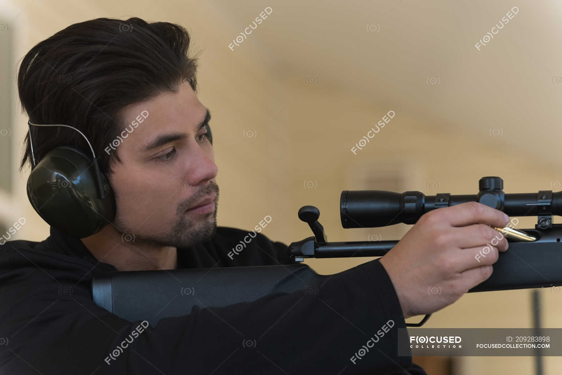 Close Up Of Man Loading Bullet Into Sniper Rifle Male One Person Stock Photo 928