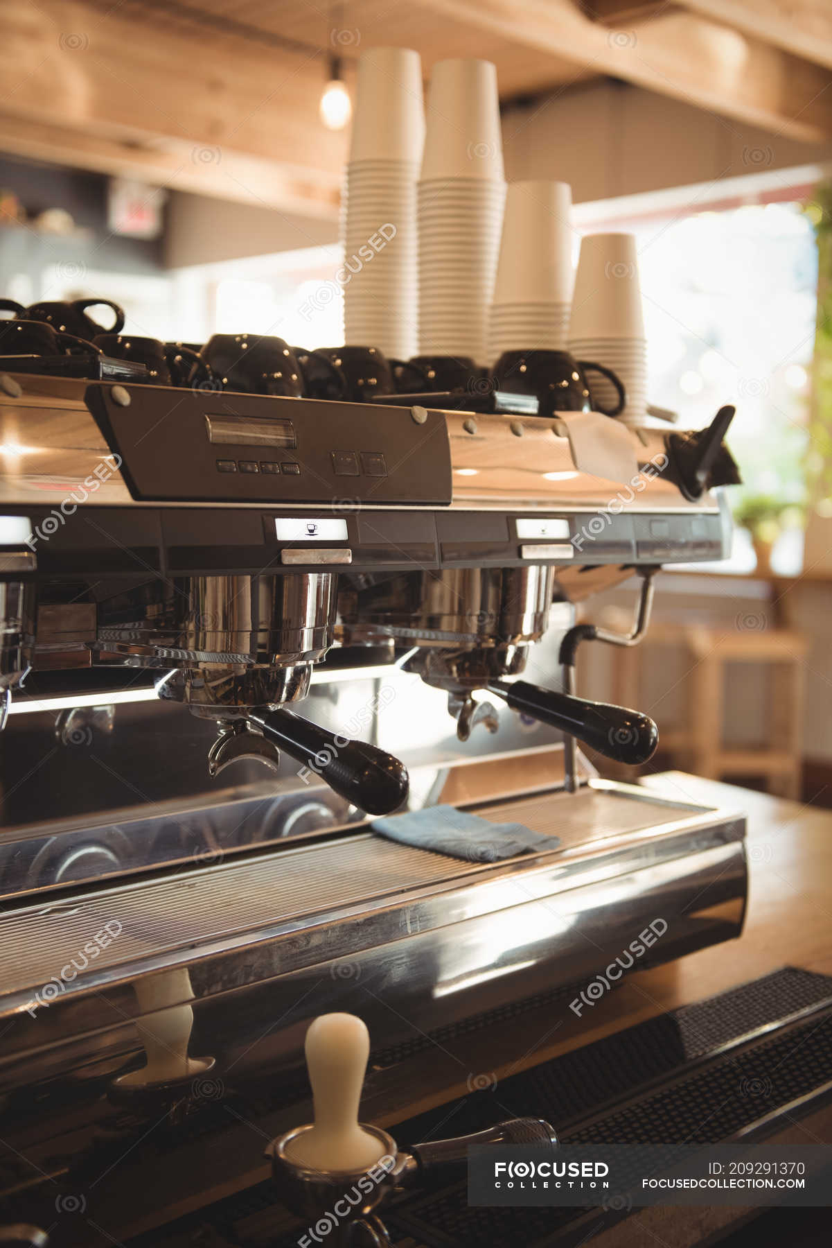 Closeup view of espresso machine in cafeteria — tamper, counter Stock Photo 209291370