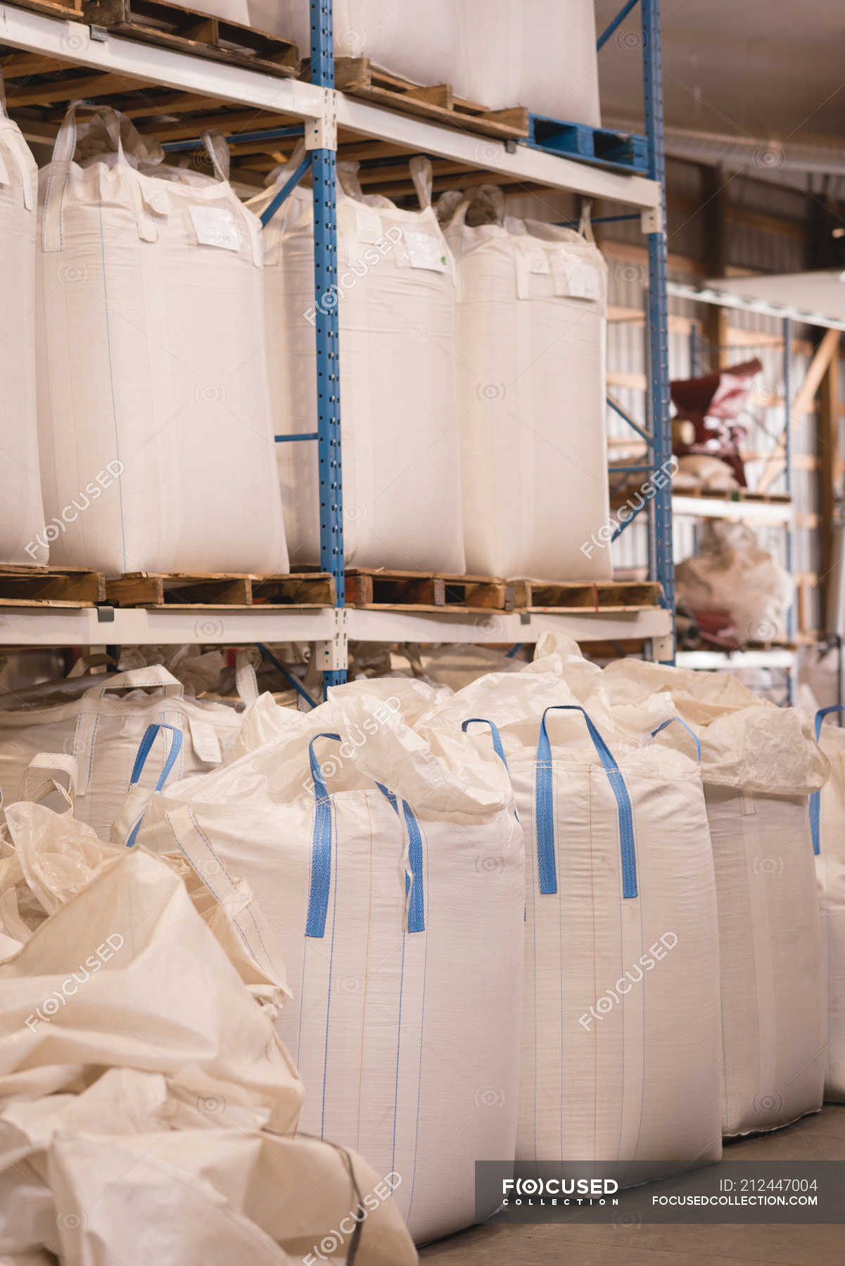 Grains in bulk bags at warehouse — factory, rack Stock Photo 212447004
