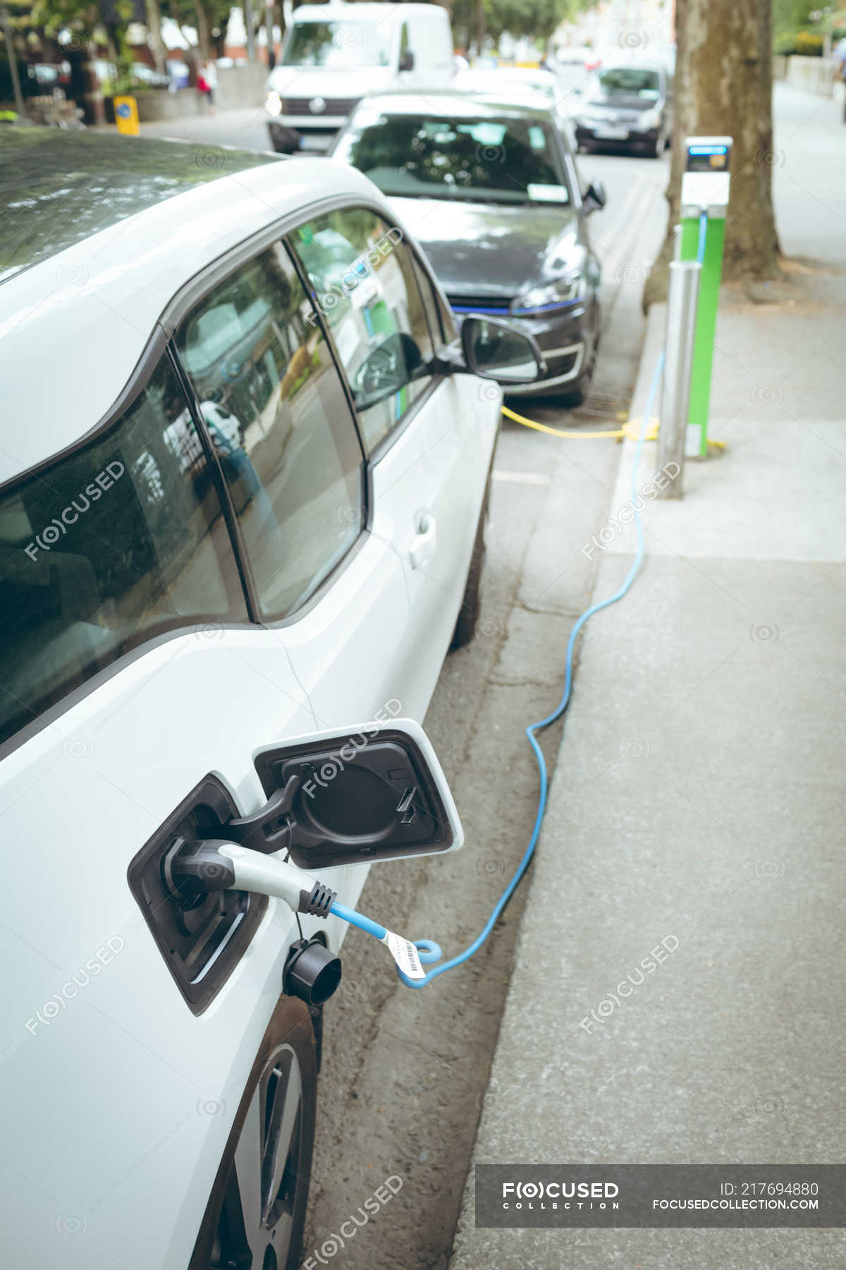 High Angle View Of Electric Car Charging At Charging Station Commuter Absence Stock Photo 217694880