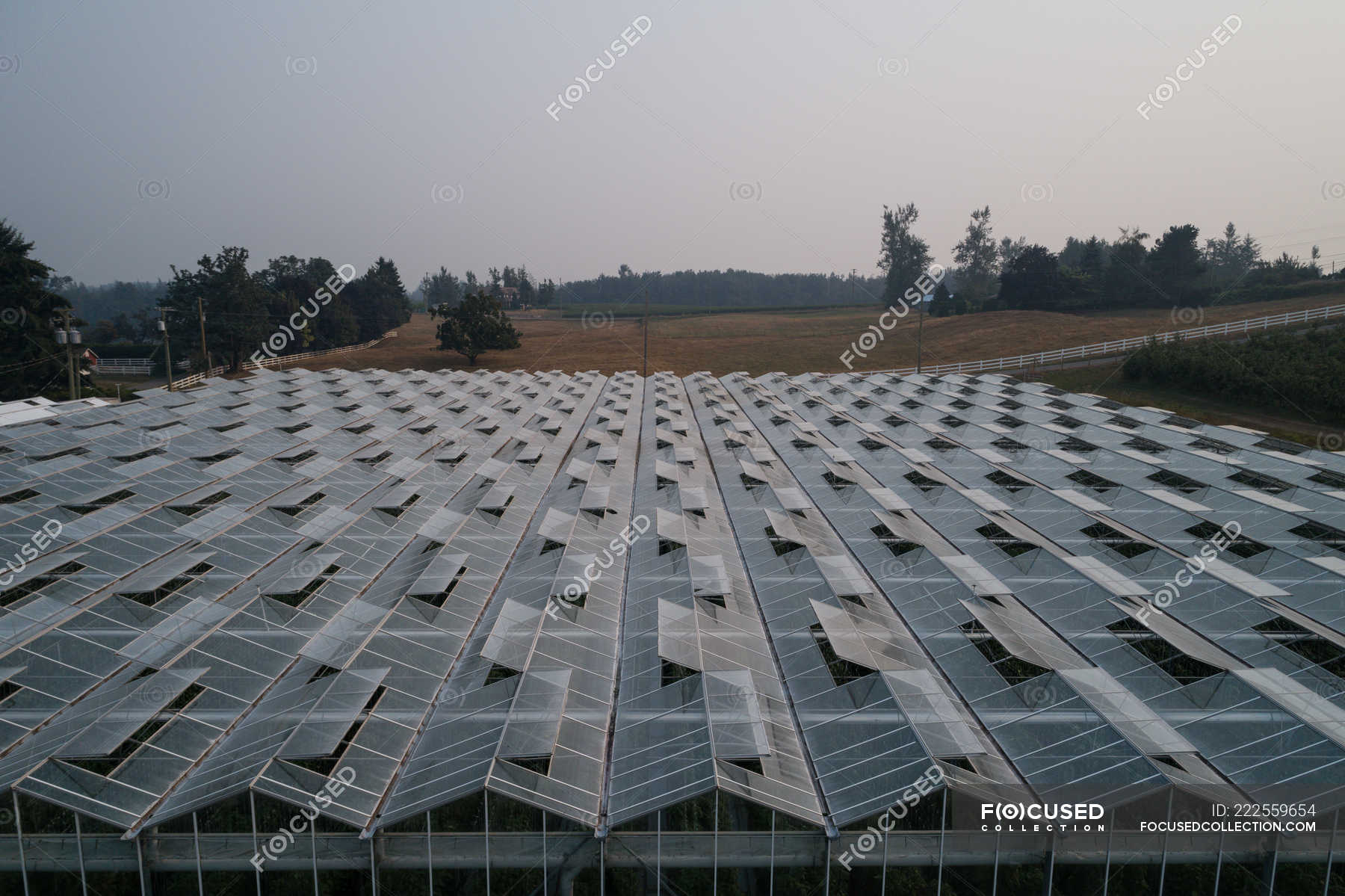 Aerial Of Futuristic Glass Roof Of Greenhouse In Farmland Gardening   Focused 222559654 Stock Photo Aerial Futuristic Glass Roof Greenhouse 