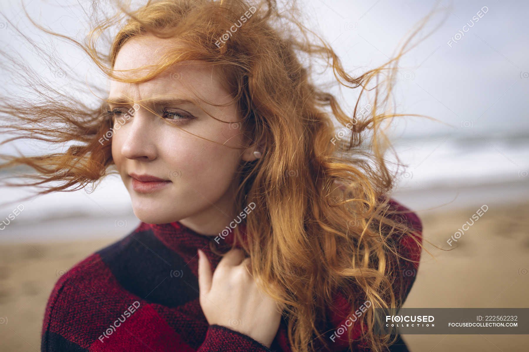 Thoughtful Redhead Woman Standing In Beach Ginger Hair Travel Stock Photo