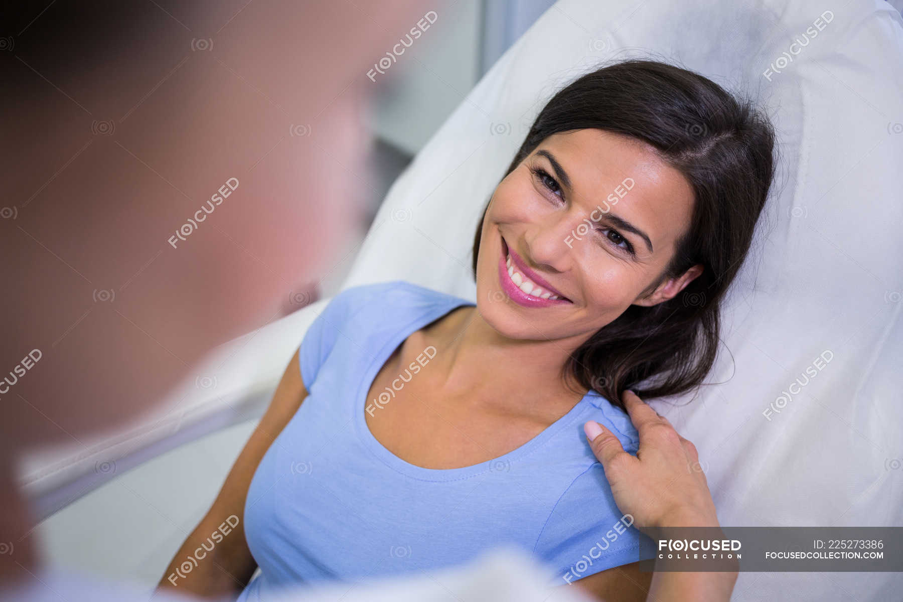 Female Patient Smiling While Talking To Doctor At Clinic Diagnostics Interacting Stock Photo 225273386 female patient smiling while talking to doctor at clinic diagnostics interacting stock photo 225273386