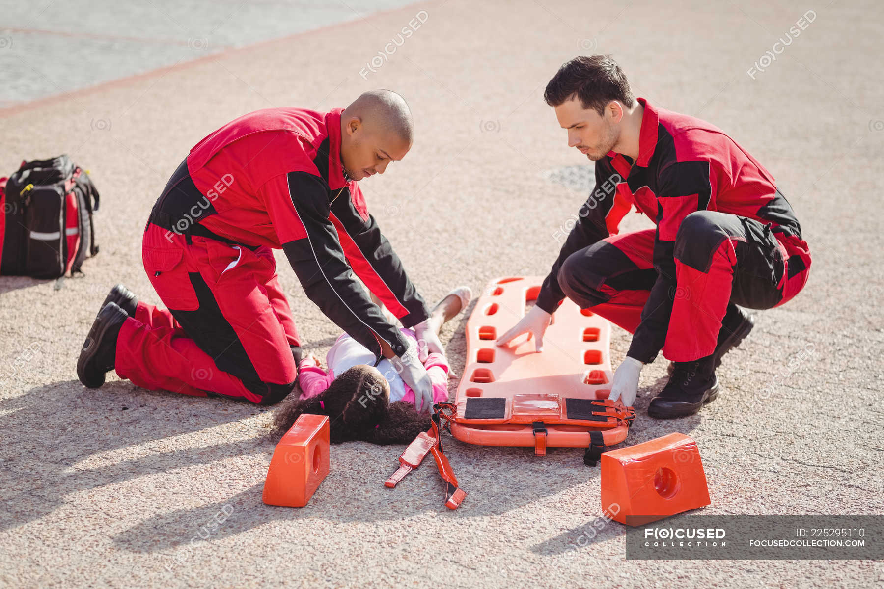 Paramedics Putting Injured Girl Onto A Backboard On Street — Injury ...