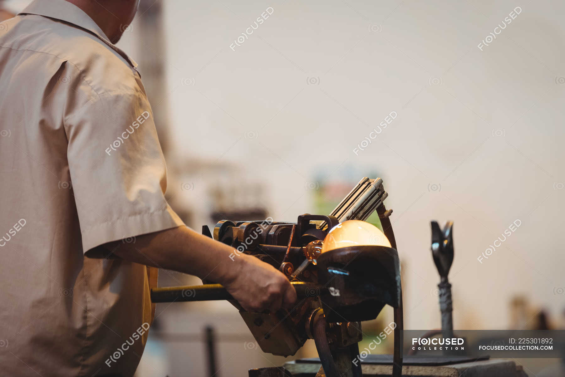 Close Up Of Glassblower Forming And Shaping A Molten Glass At Glassblowing Factory — Process