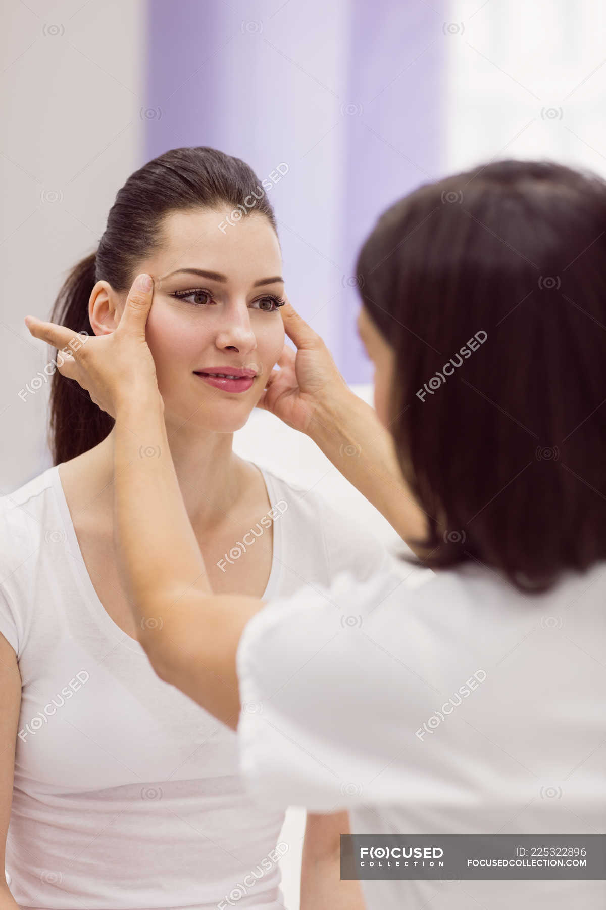 Dermatologist Examining Female Patient Skin In Clinic — Beautiful Caucasian Ethnicity Stock