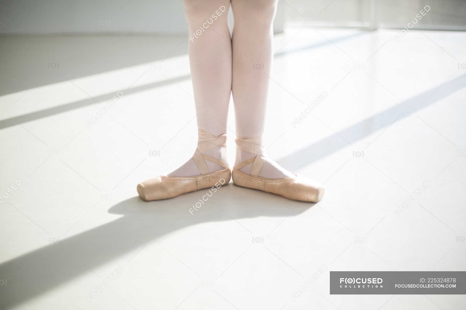 Low Section Of Ballet Dancer Feet Performing Ballet Dance In The Ballet Studio Graceful Practicing Stock Photo