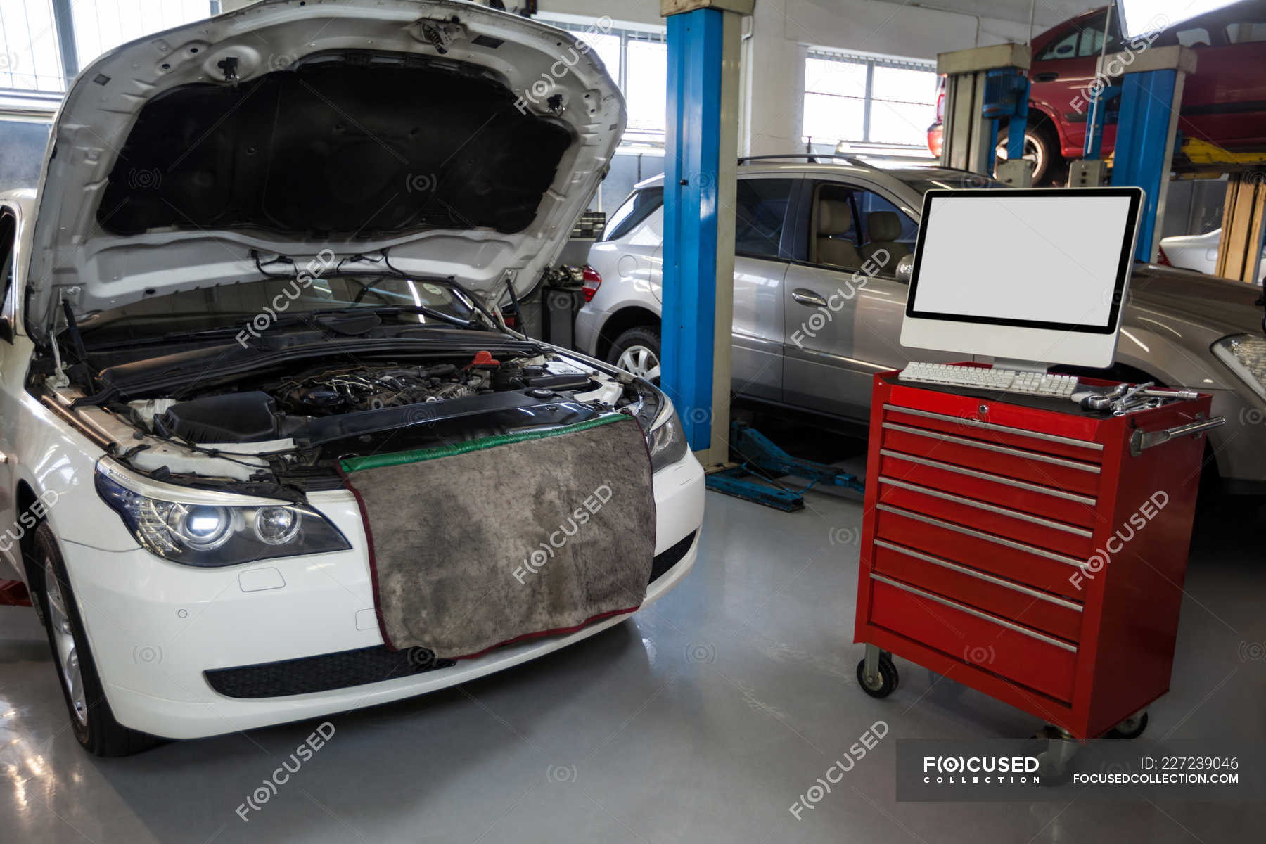 Car With Open And Diagnostic Device In Repair Garage — Auto