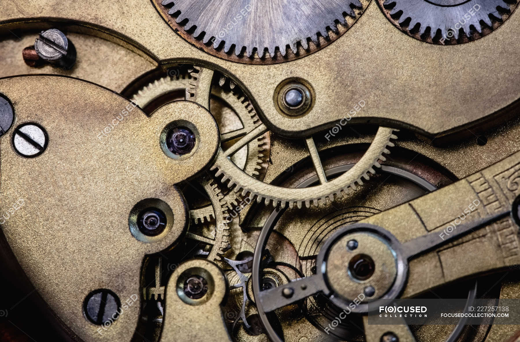 Closeup of old pocket watch machine with gears — business, metallic