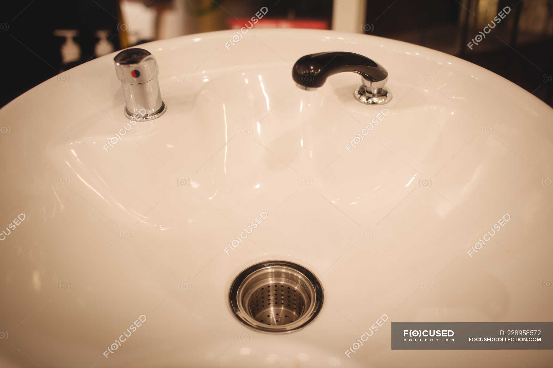 Close-up of modern white sink at saloon — furniture, style - Stock ...