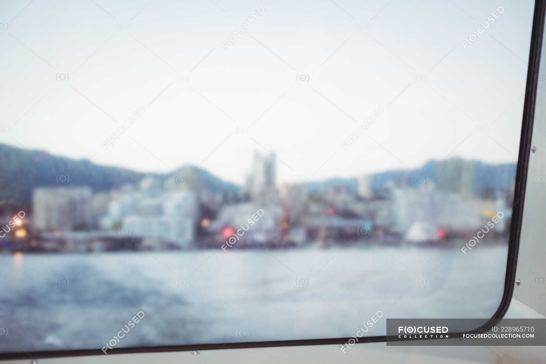 Blurred View Of Harbor City From Window Glass Pane Sky Indoors Stock Photo